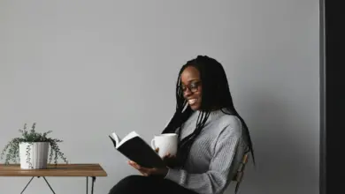 A girl sitting in the Corner and Reading Recommended Reading