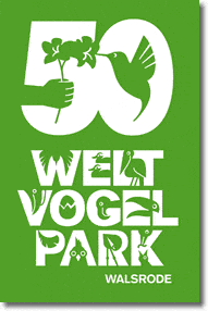 A green and white graphic poster for Weltvogelpark Walsrode's 50th anniversary features a stylized number "50," with a hand holding flowers and a bird. Bird icons, including the Firetail Finch species, are integrated into the letters of "WELT VOGEL PARK WALSRODE.